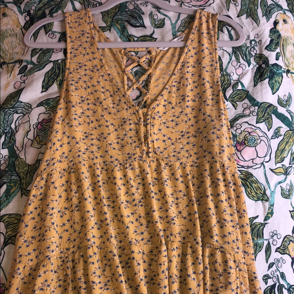 Yellow top with blue floral pattern